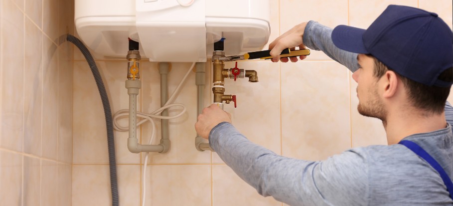 Man fixing a boiler that is loosing pressure