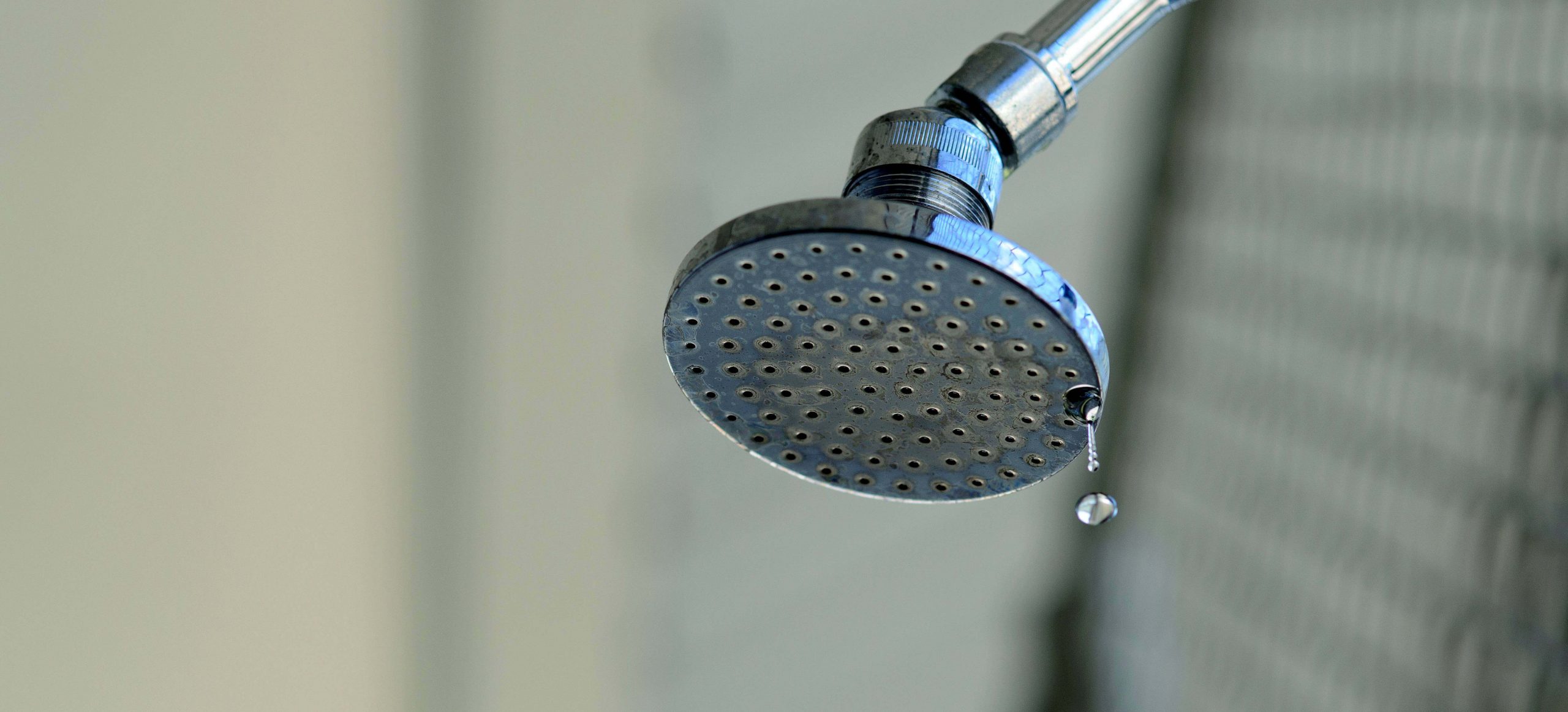 A photo of a leaking shower head